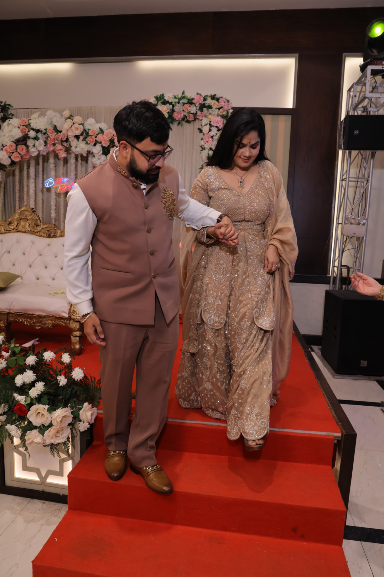 The couple walking down the red carpet hand in hand
